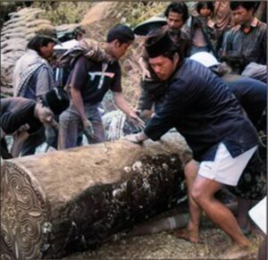 Reopening of the coffin for rewrapping of body and final insertion in tomb.
